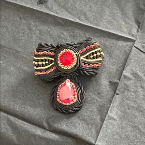 Black Cord and Red Crystal Accent Brooch